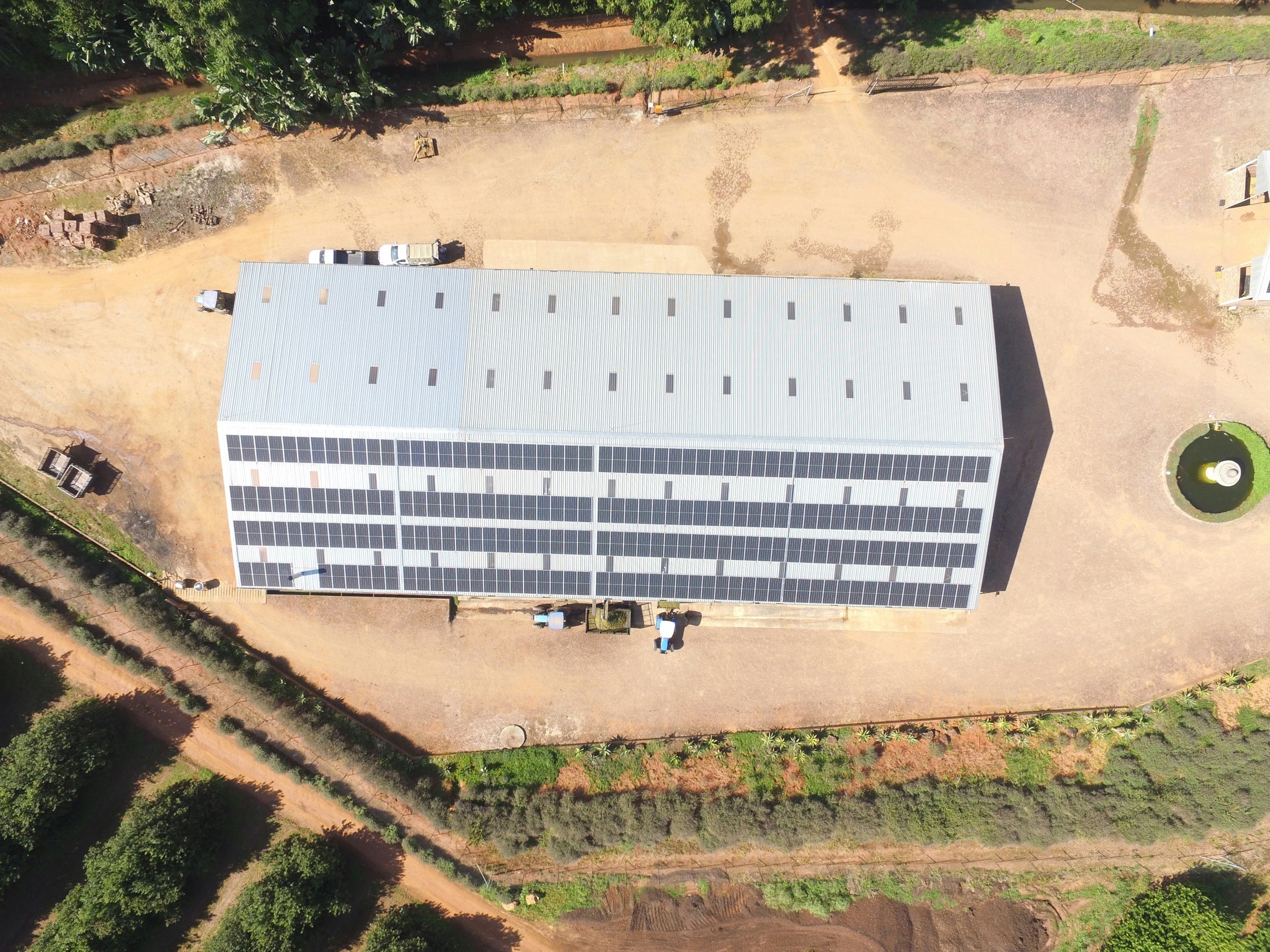 Aerial view of an industrial building clad in solar panels