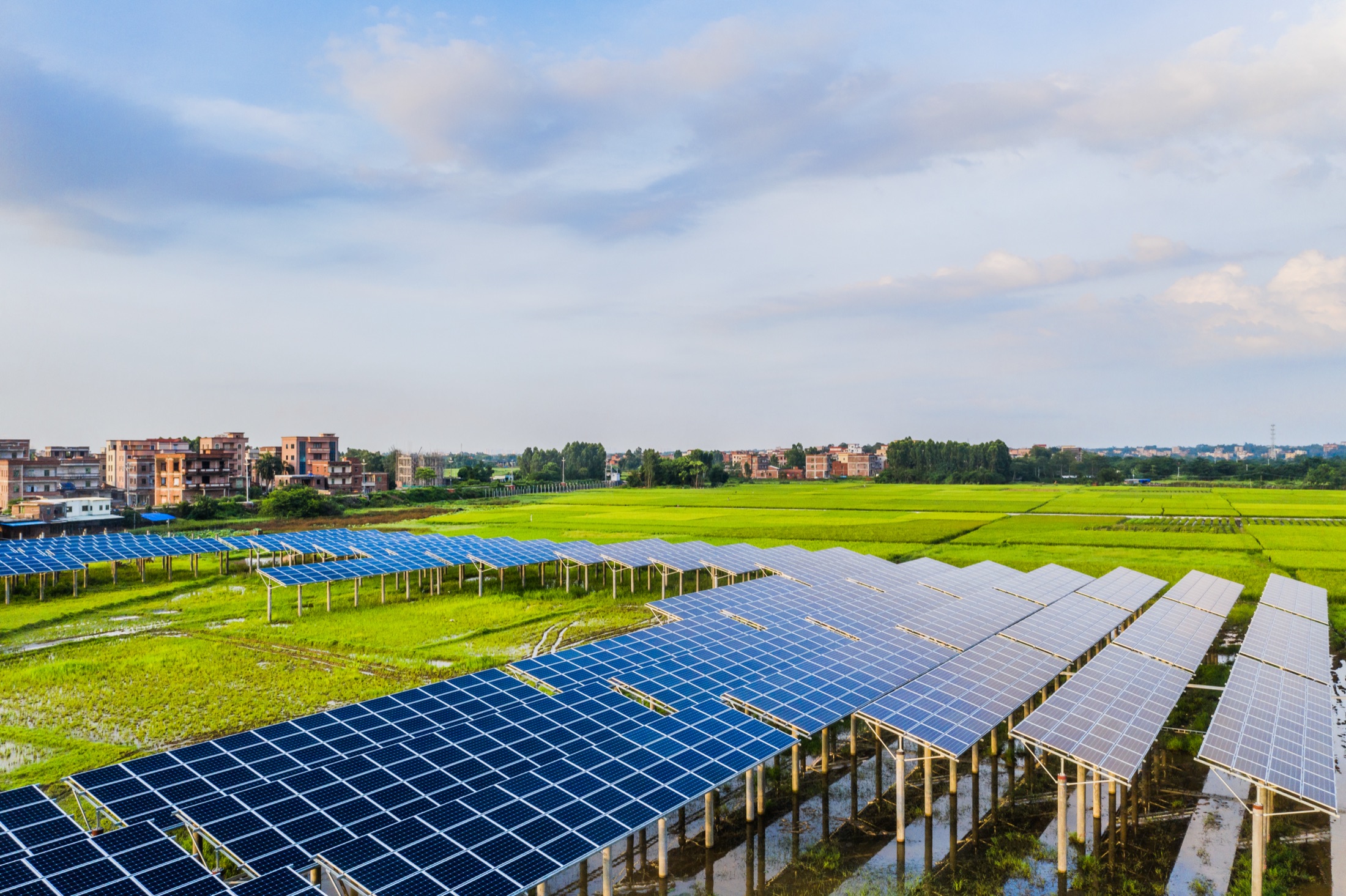 Solar plant on open land under a bright sky
