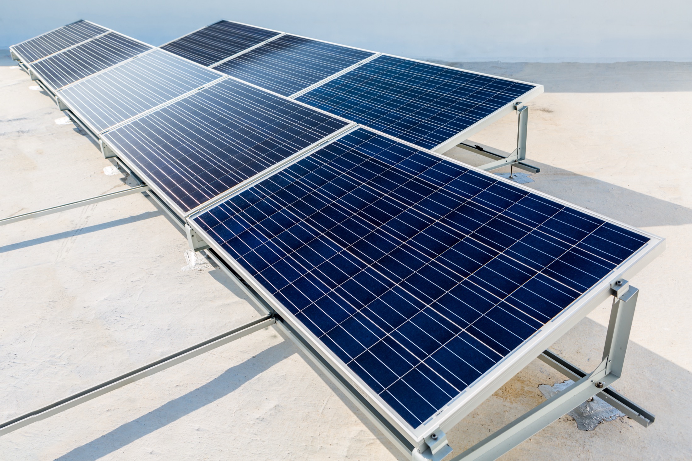 Solar modules on a bright white rooftop